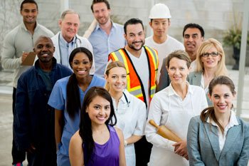 A diverse group of 13 professionals, including doctors, nurses, construction workers, and businesspeople, pose together for a photo.